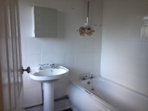 white bathroom suite in auction property